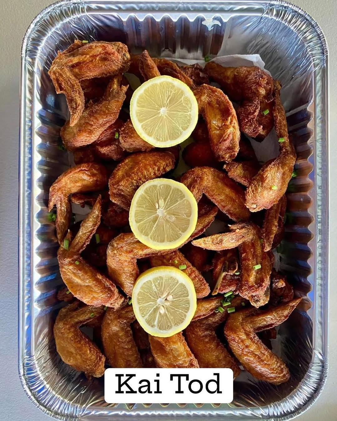 Customer party tray order spread — Thai food feast for a group celebration